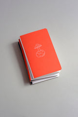 Pocket-sized softcover notebook with an illustration of a mushroom growing on the Moon.