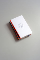 Pocket-sized softcover notebook with an illustration of a sleeping Moon.
