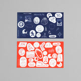 A set of moon-themed stickers in orange and navy colors.