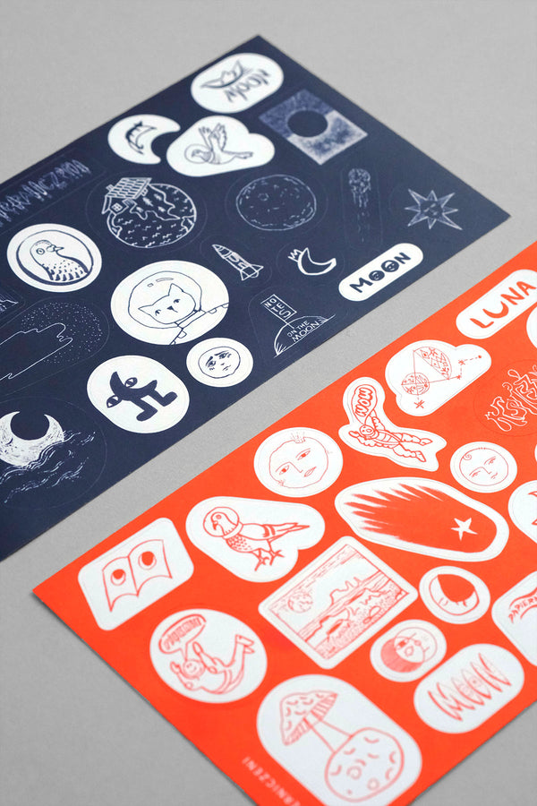 A set of moon-themed stickers in orange and navy colors.