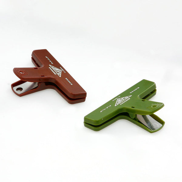 Green and burgundy plastic paper clips.