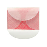 A semi-transparent envelope with a sheet of decorative paper in red inside.