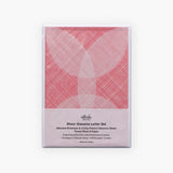 Packaging of a letter-writing set with envelopes made from semi-transparent paper and decorative sheets for concealing the content of the letter, in red.
